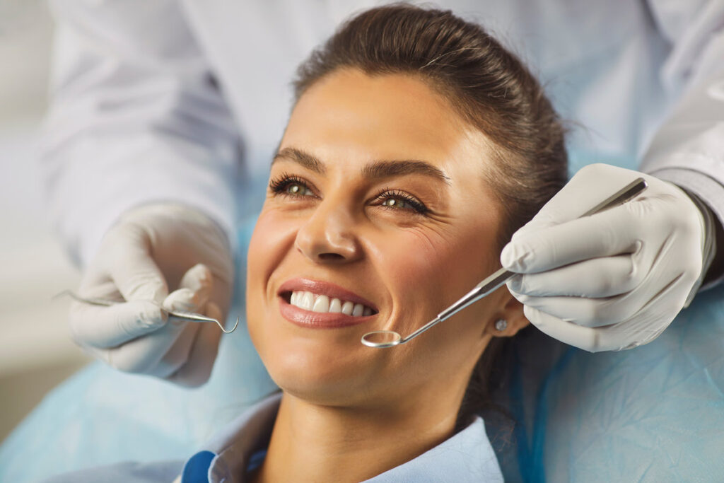 Woman showing perfect white toothy smile after whitening dental treatment procedure showing result, health stomatology dentistry service, oralcare, dentist, happy female patient in med clinic