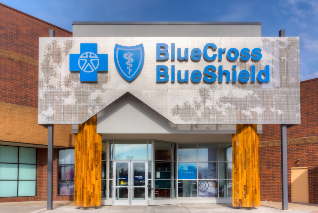 MINNEAPOLIS, MN/USA - MARCH 19, 2017: Blue Cross Blue Shield exterior and logo. Blue Cross Blue Shield Association (BCBSA) is a federation of health insurance organizations and companies.