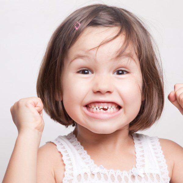 The child dropped the first milk tooth