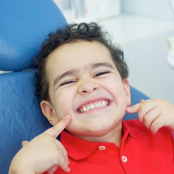 Playing dentist in the dental office. The patient is happy and satisfied.