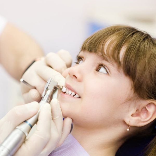 close-up medical dentist procedure of teeth polishing with clean