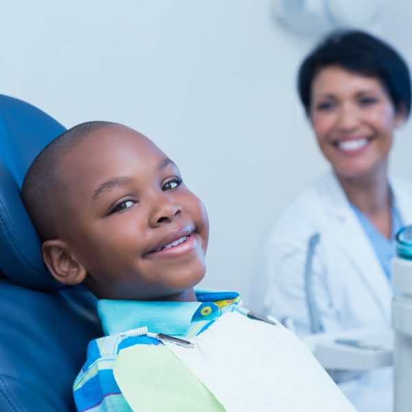 Smiling boy waiting for a dental exam